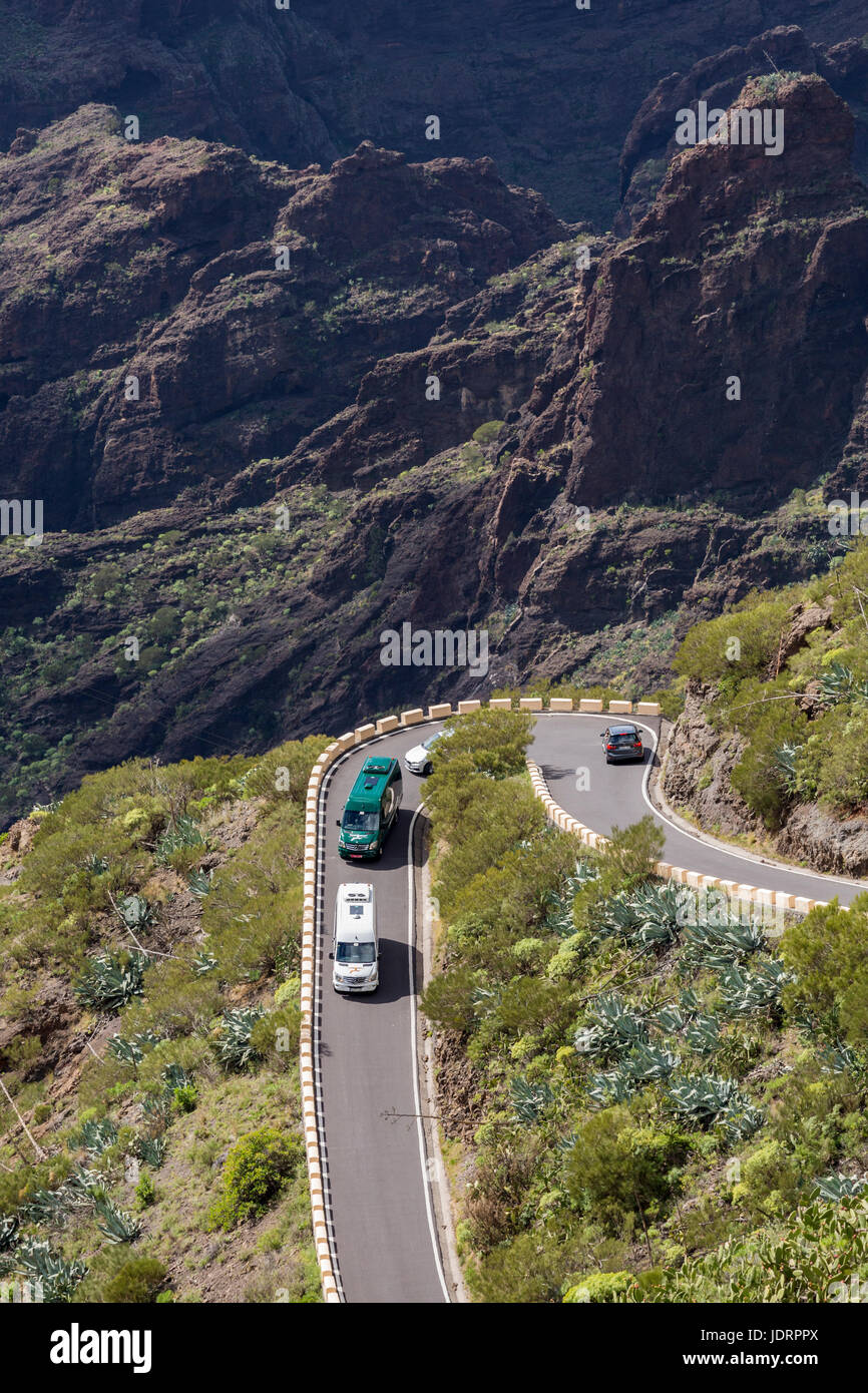 Traffic, minibuses, cars, coaches on the narrow mountain road from Santiago del Teide to Masca in Tenerife, Canary Islands, Spain Stock Photo