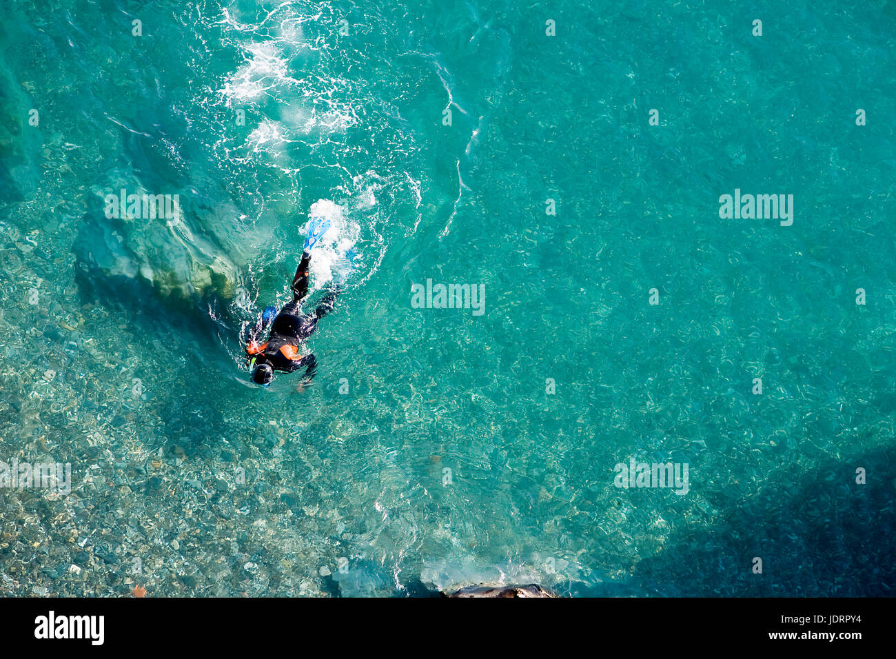 Scuba diver on the surface of the sea, Almu–ecar, Granada province, Spain Stock Photo