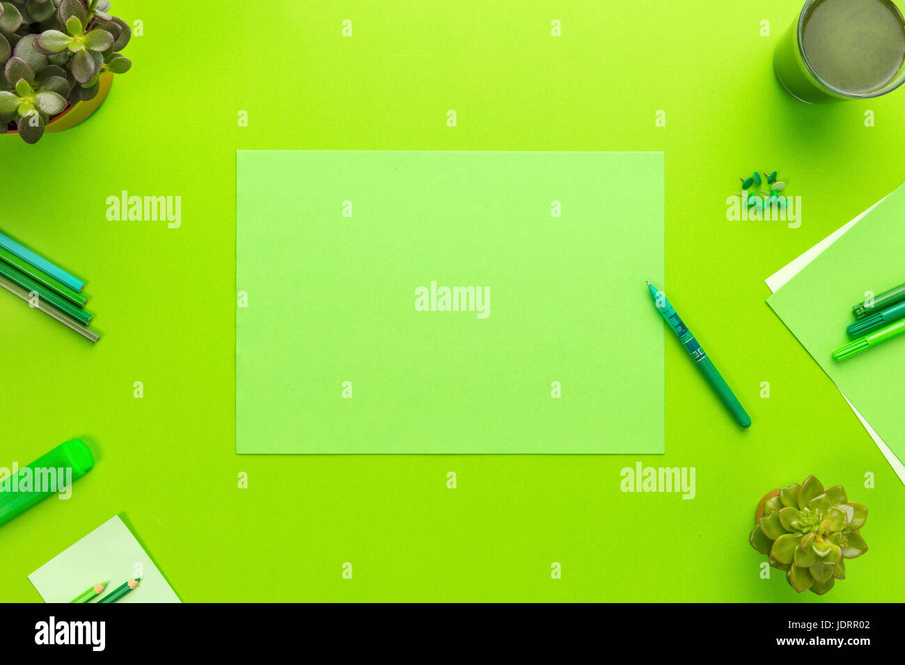 Environmental concept of a green office desk with supplies Stock Photo