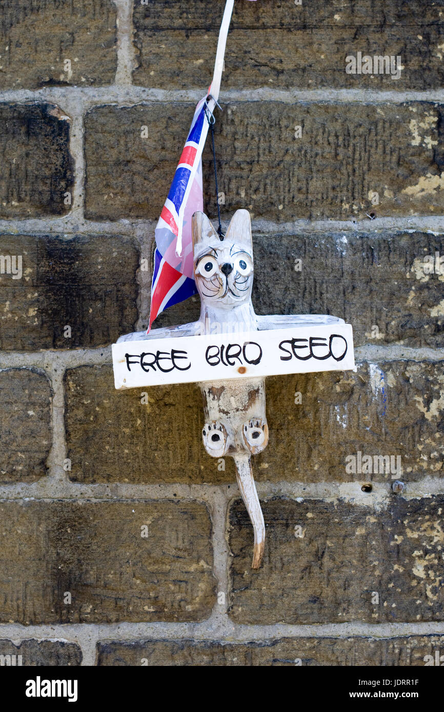 Free bird seed holder attached to a wall hires stock photography and