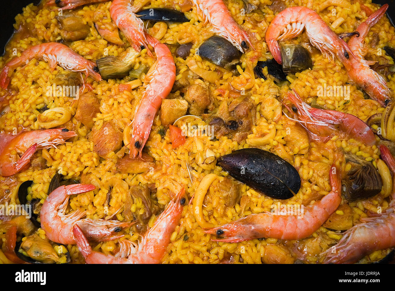 Paella with prawns and mussels, typical Spanish dish, ingredients of