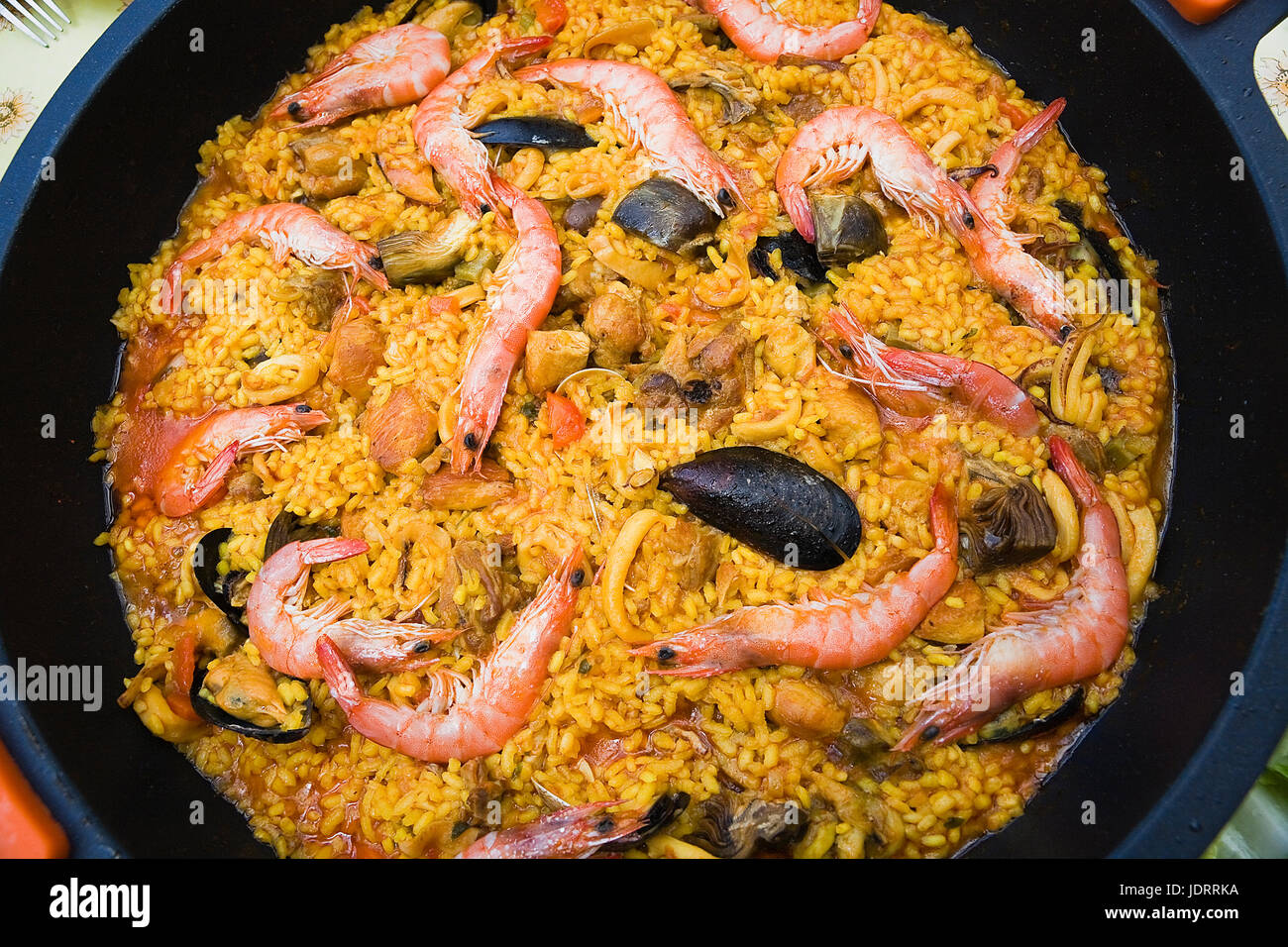 Paella with prawns and mussels, typical Spanish dish, ingredients of