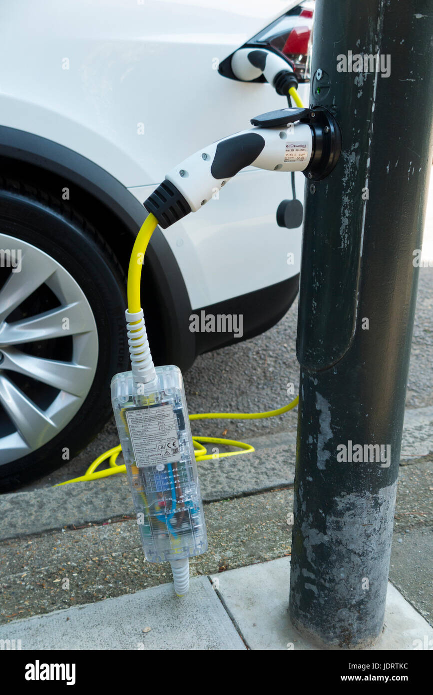 An electric car charger conversion by Ubitricity: smart cable on a street lamp which can now be used to charge a vehicle from lamp post. Twickenham UK Stock Photo