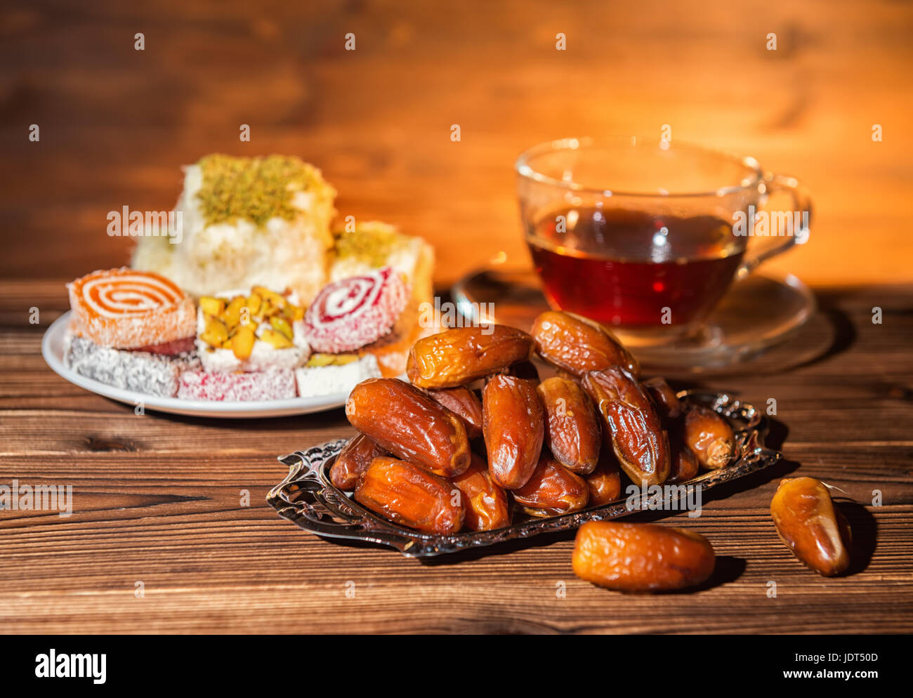 dates, candy and cup of tea, concept of muslim feast holy month Ramadan