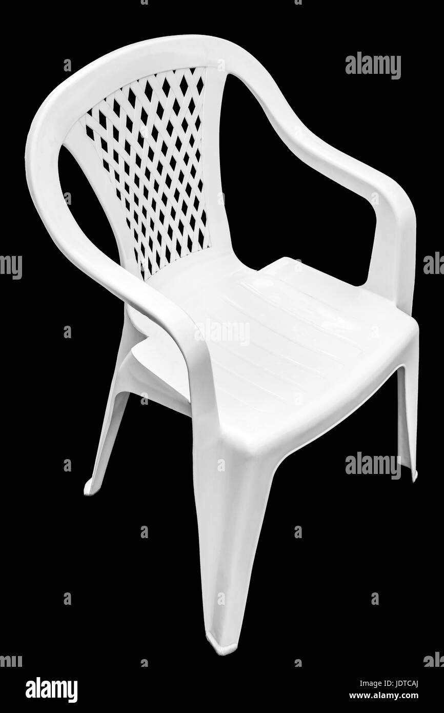 White plastic chair closeup on a black background Stock Photo Alamy