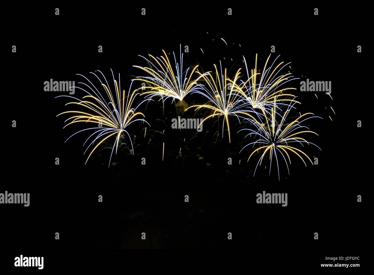 Firework. Beautiful colorful fireworks on the water surface with a clean black background. Fun festival and contest of Firefighters  Brno Dam - Czech  Stock Photo