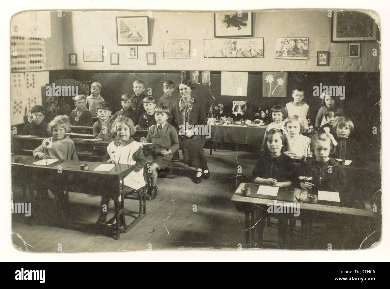 Postcard of infants at Watermoor School with teacher Miss Bartlett, Cirencester, England,  U.K. dated 1929 Stock Photo