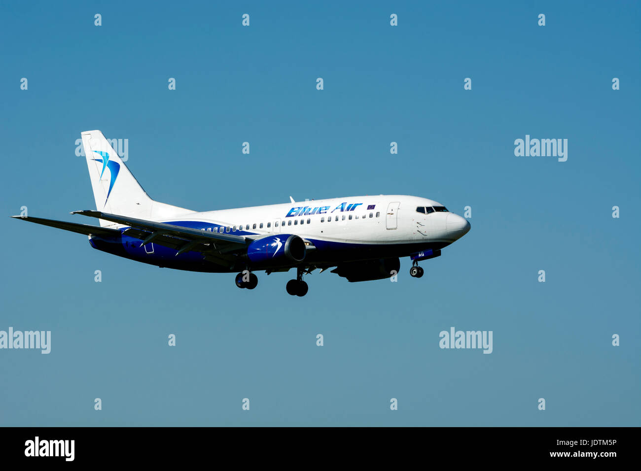 Blue Air Boeing 737 landing at Birmingham Airport, UK (YR-BAG) Stock Photo