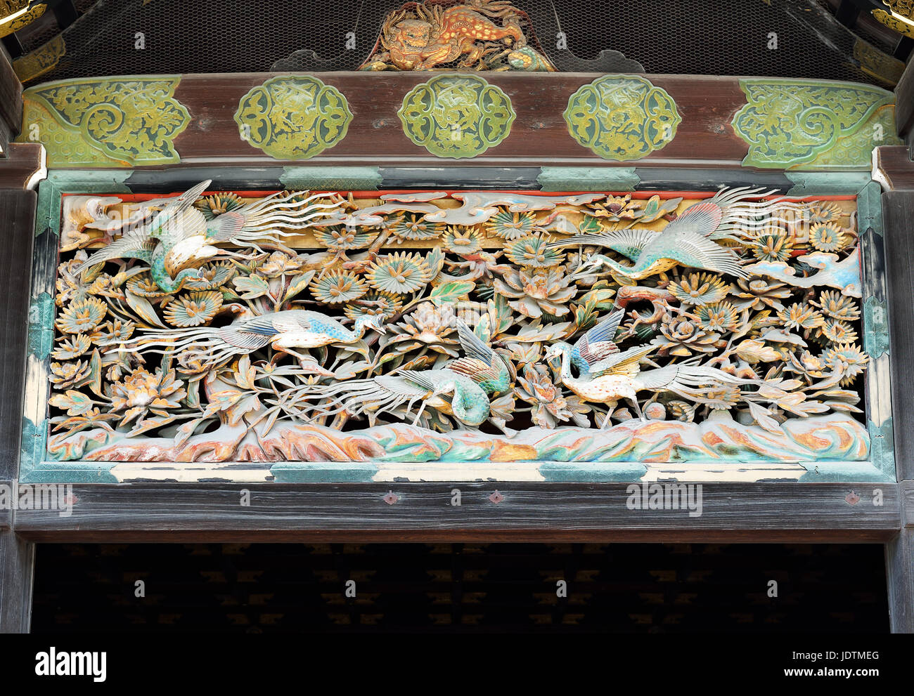 Closeup of transom window carved with colorful birds and flowers, Ninomaru-goten Palace, Nijo Castle, Kyoto, Japan Stock Photo