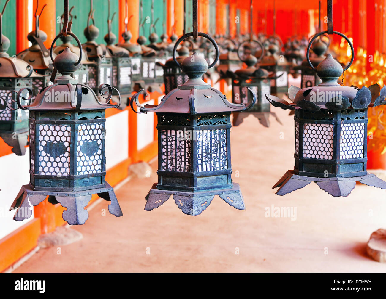 Rows of metal lanterns hanging in Kasuga Taisha Shrine, Nara, Japan Stock Photo