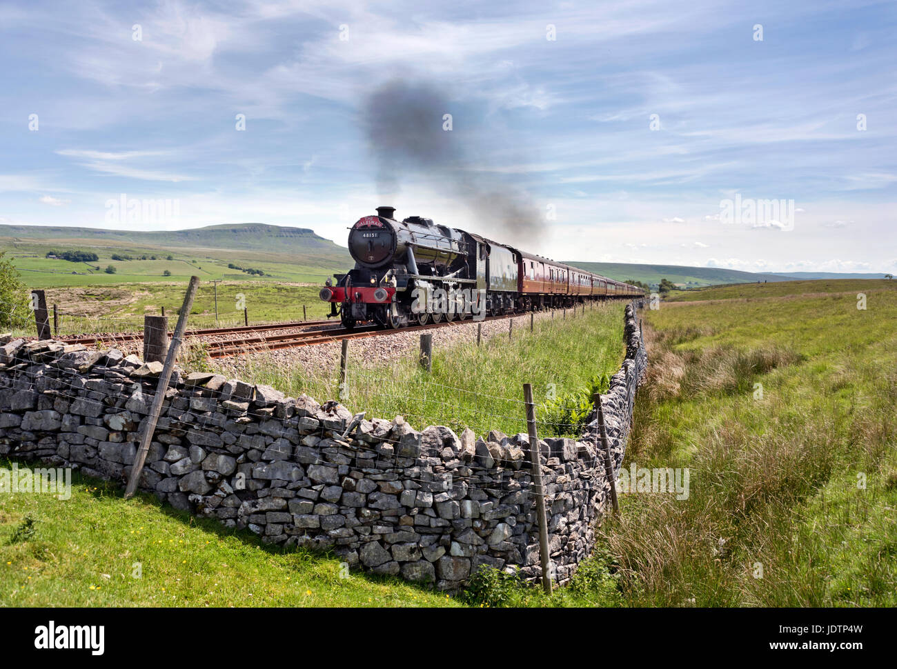 The Dalesman steam special at Selside on the Settle- Carlisle railway line, with Pen-y-Ghent peak on the horizon, Yorkshire Dales National Park, UK. Stock Photo