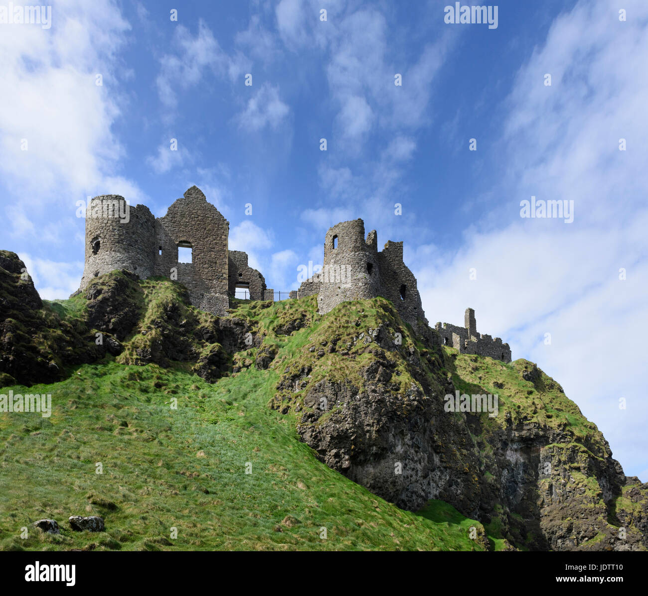 Dunluce Castle in a dramatic clifftop setting on the Causeway Coast of County Antrim Northern Ireland Stock Photo