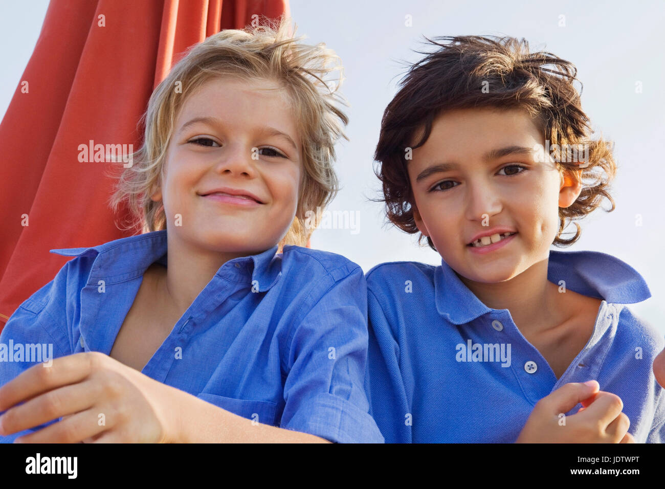 Portrait of two relaxed kids smiling Stock Photo