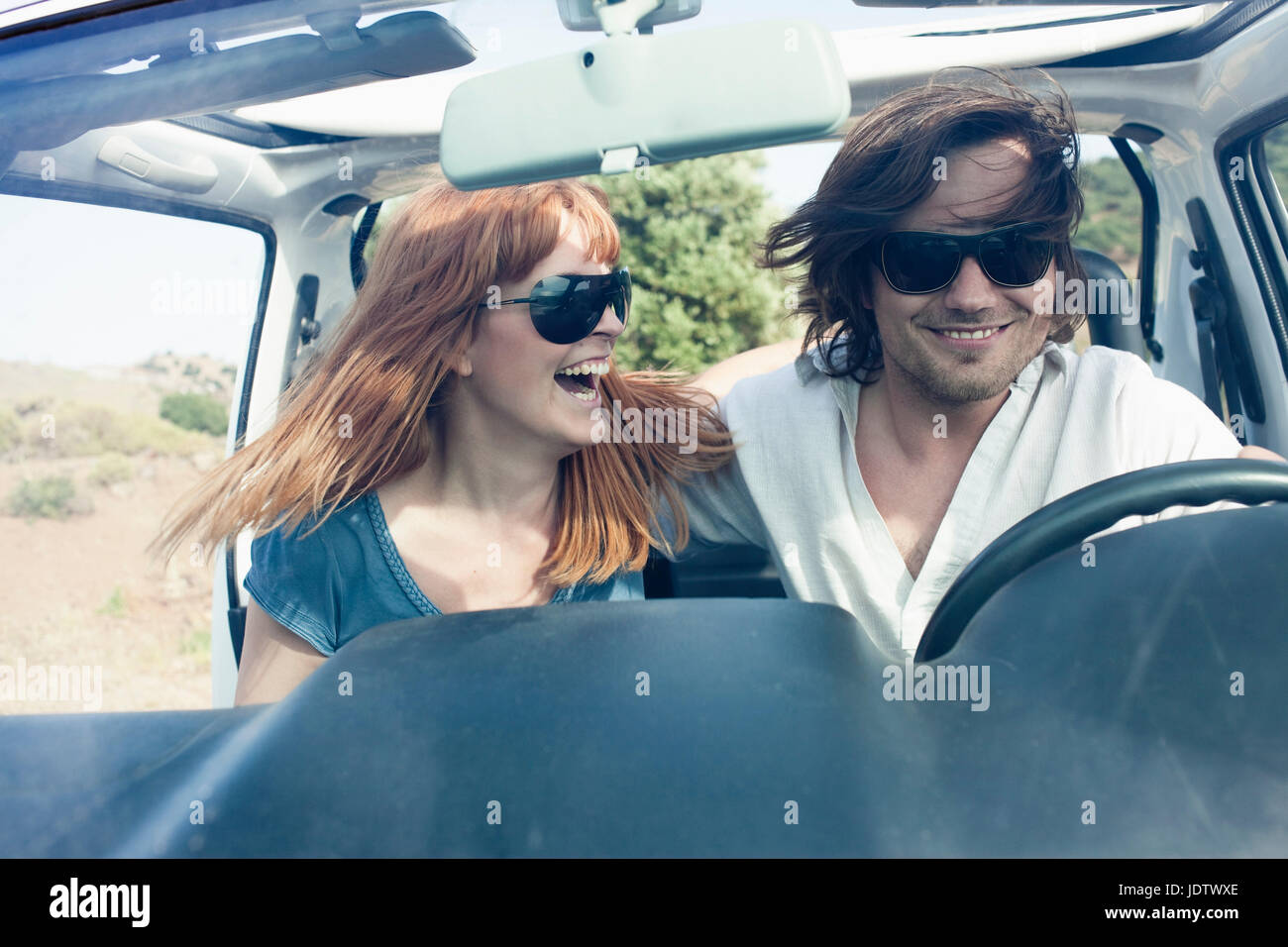 Young couple in off road car Stock Photo