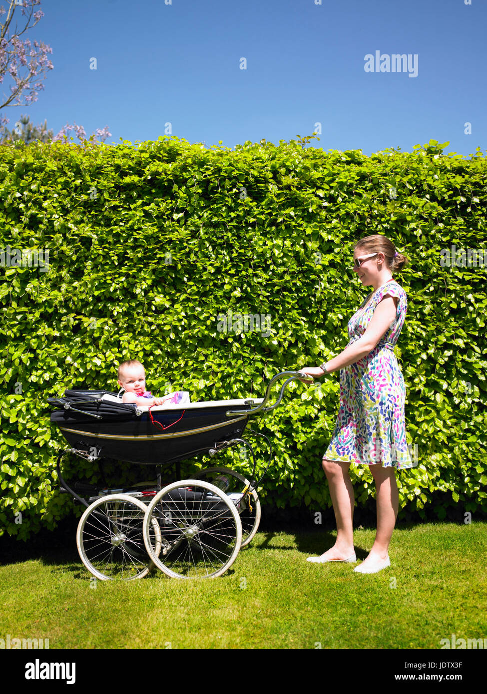 Mother Pushing Pram Stock Photo Alamy