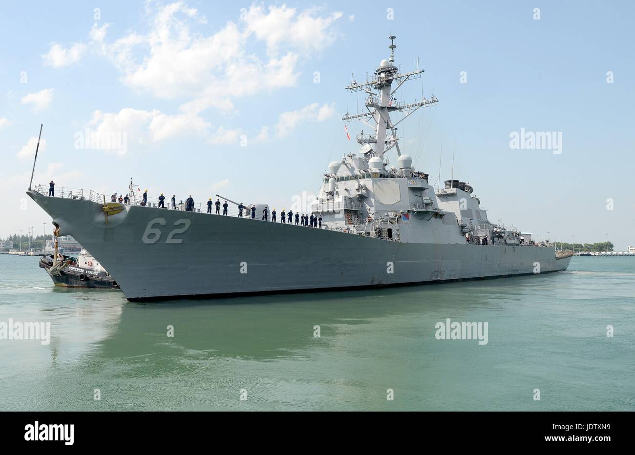 The U.S Navy Arleigh Burke-class guided missile destroyer USS Fitzgerald departs Changi Naval Base during CARAT Singapore 2013 training exercise July 21, 2013 in Singapore. Stock Photo