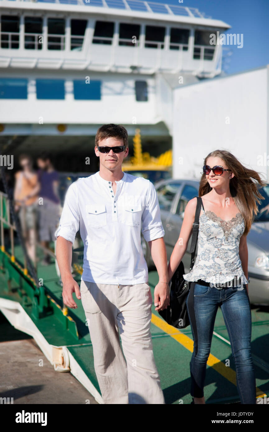 Man walking with girlfriend on ferry Stock Photo