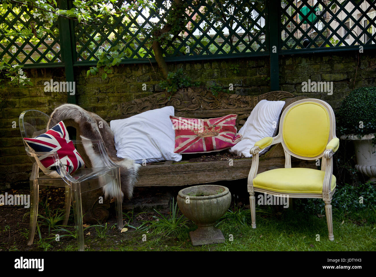 Pillows on sofa and chairs in backyard Stock Photo