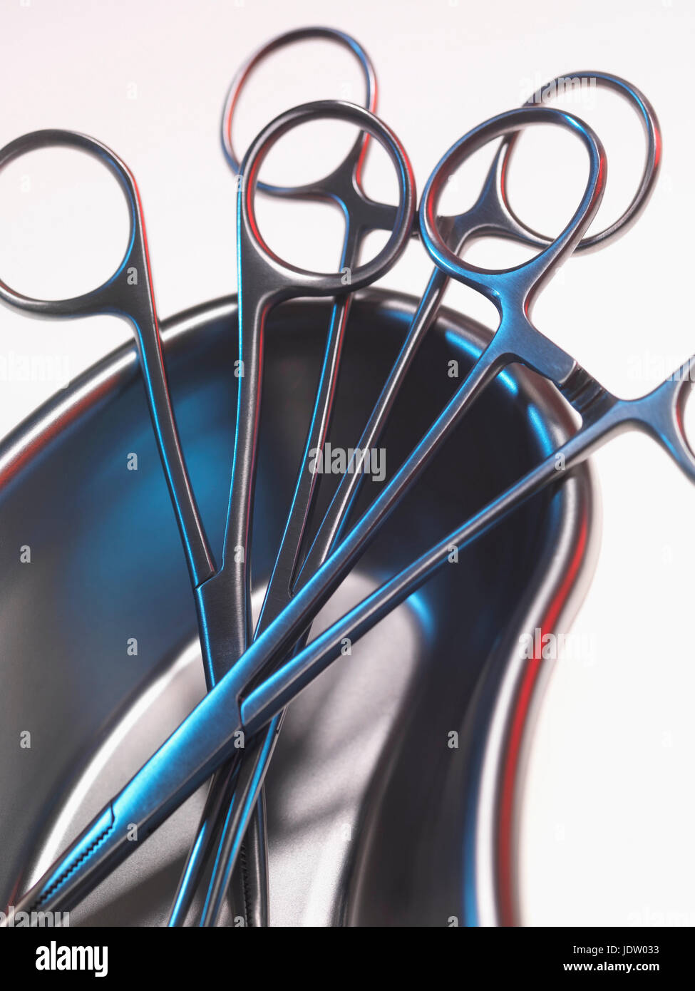 Close up of scissor forceps in bowl Stock Photo