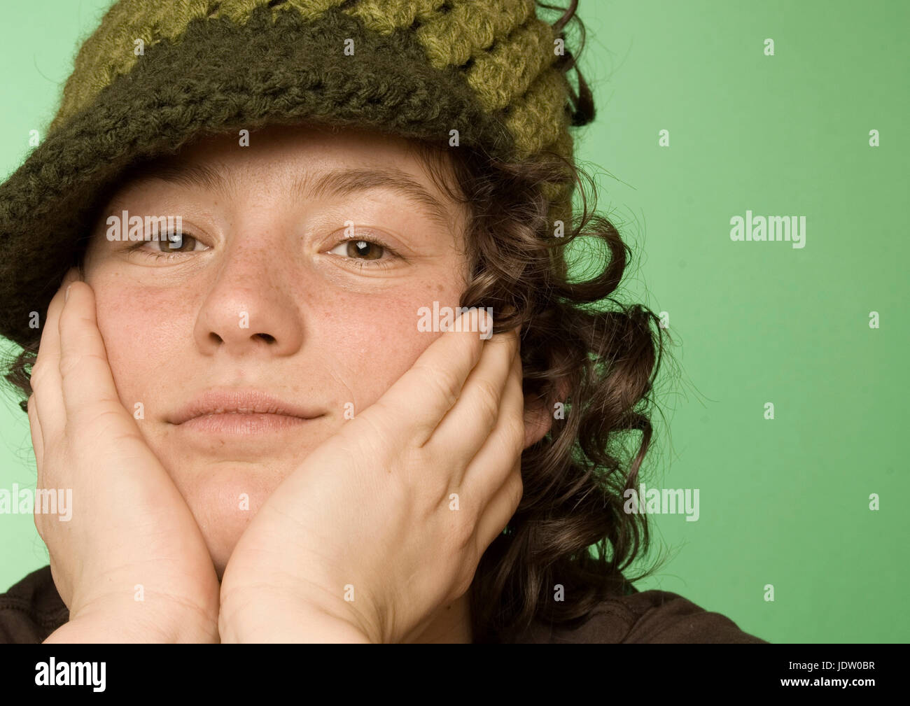 Man resting chin on hands Stock Photo Alamy