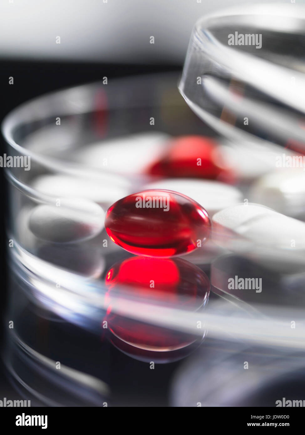 Close up of pills in clear jar Stock Photo