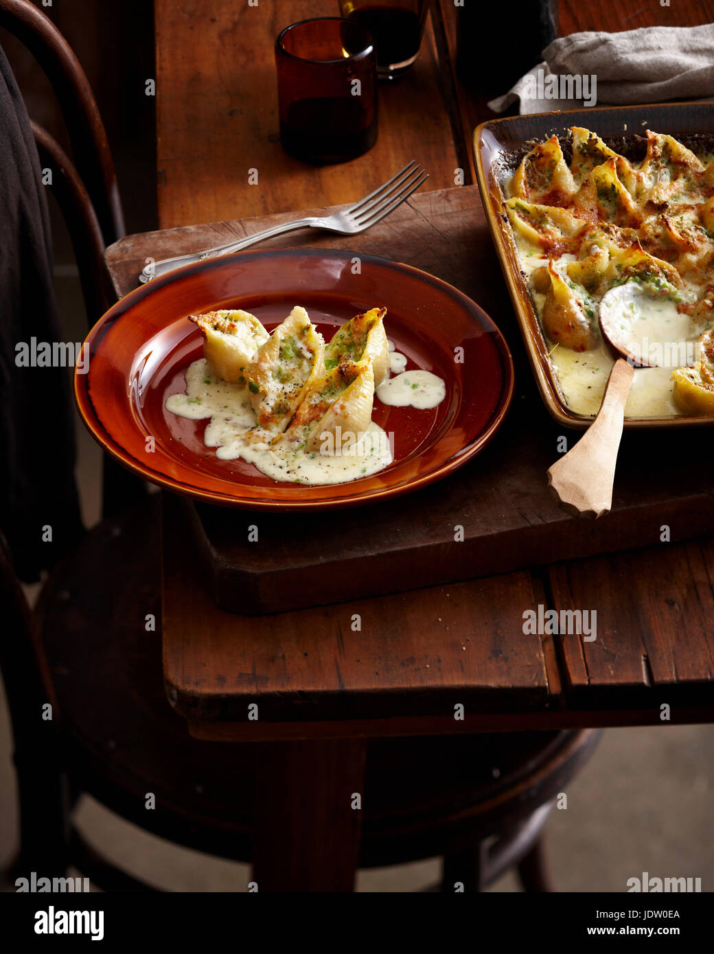 Plate of stuffed fruit with cream sauce Stock Photo