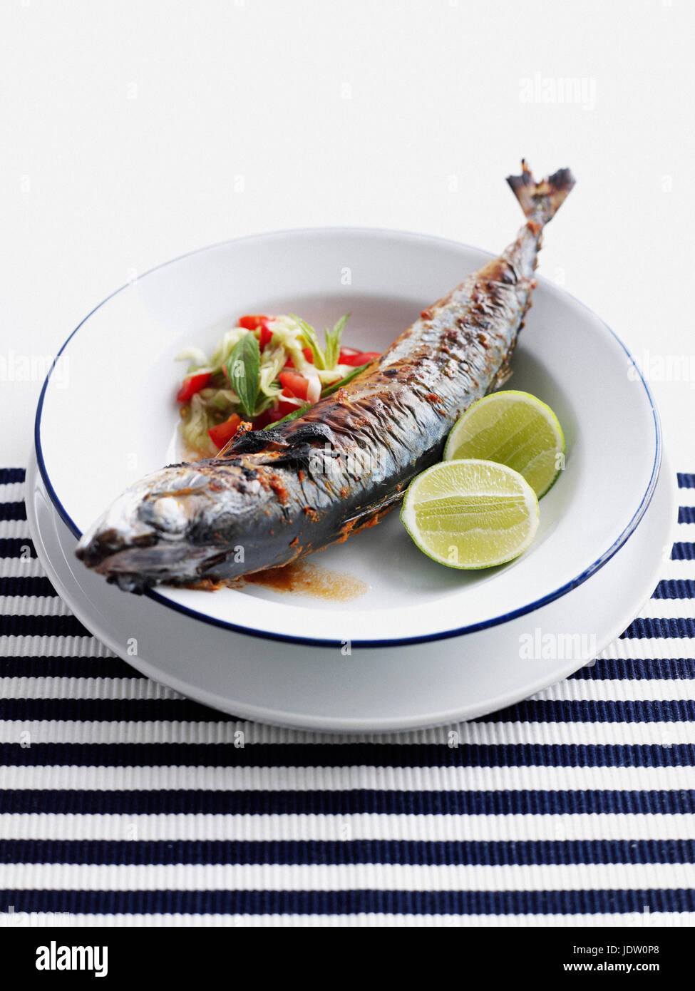 Plate of grilled fish with salad Stock Photo