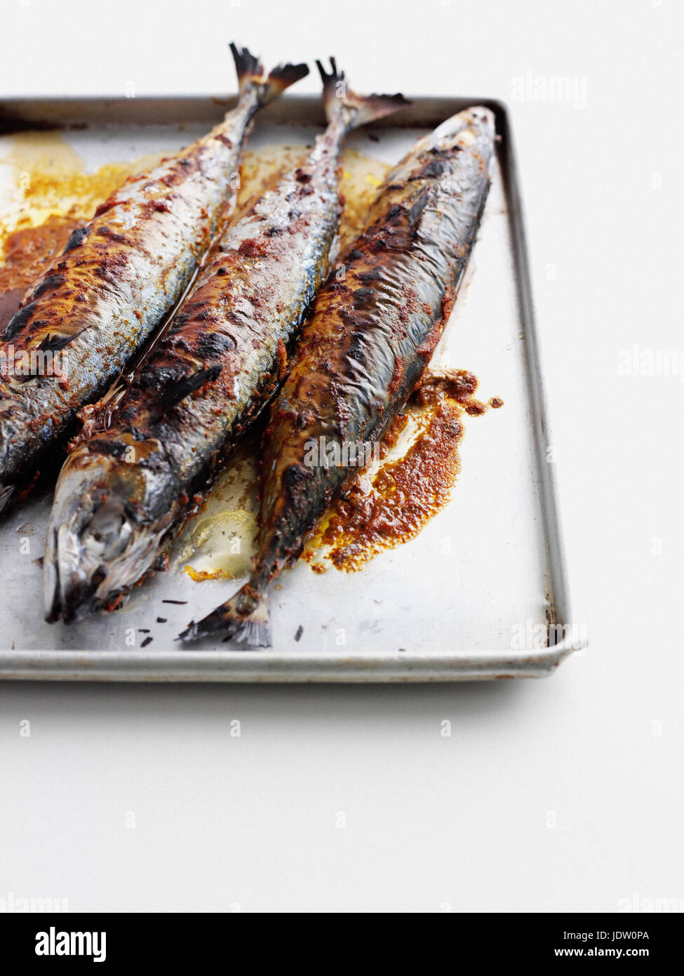 Pan of grilled fish Stock Photo - Alamy