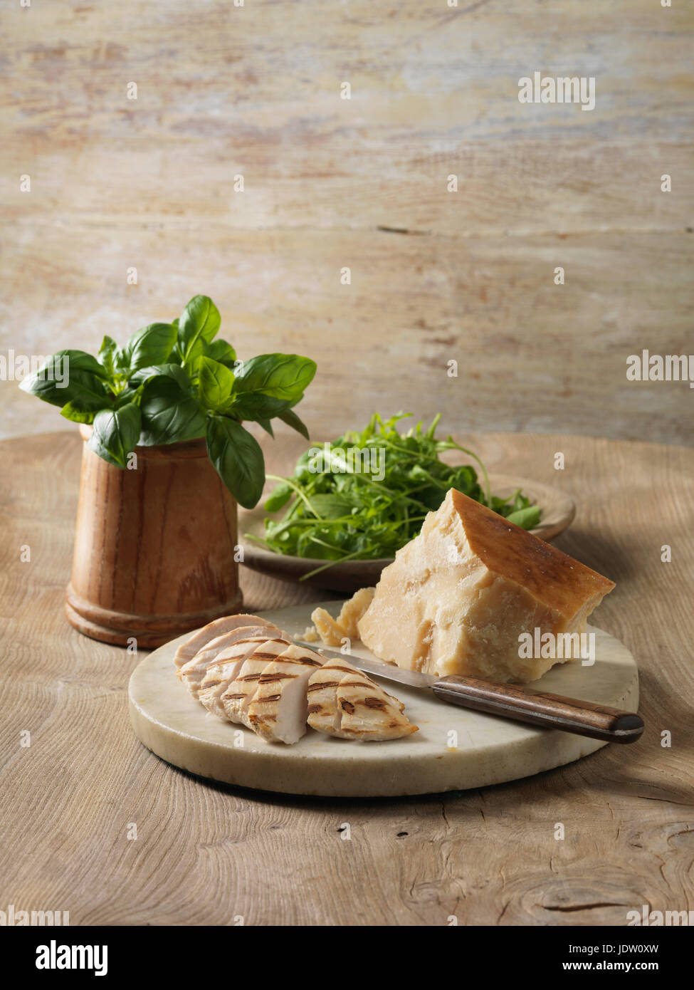 Plate of chicken, cheese and herbs Stock Photo