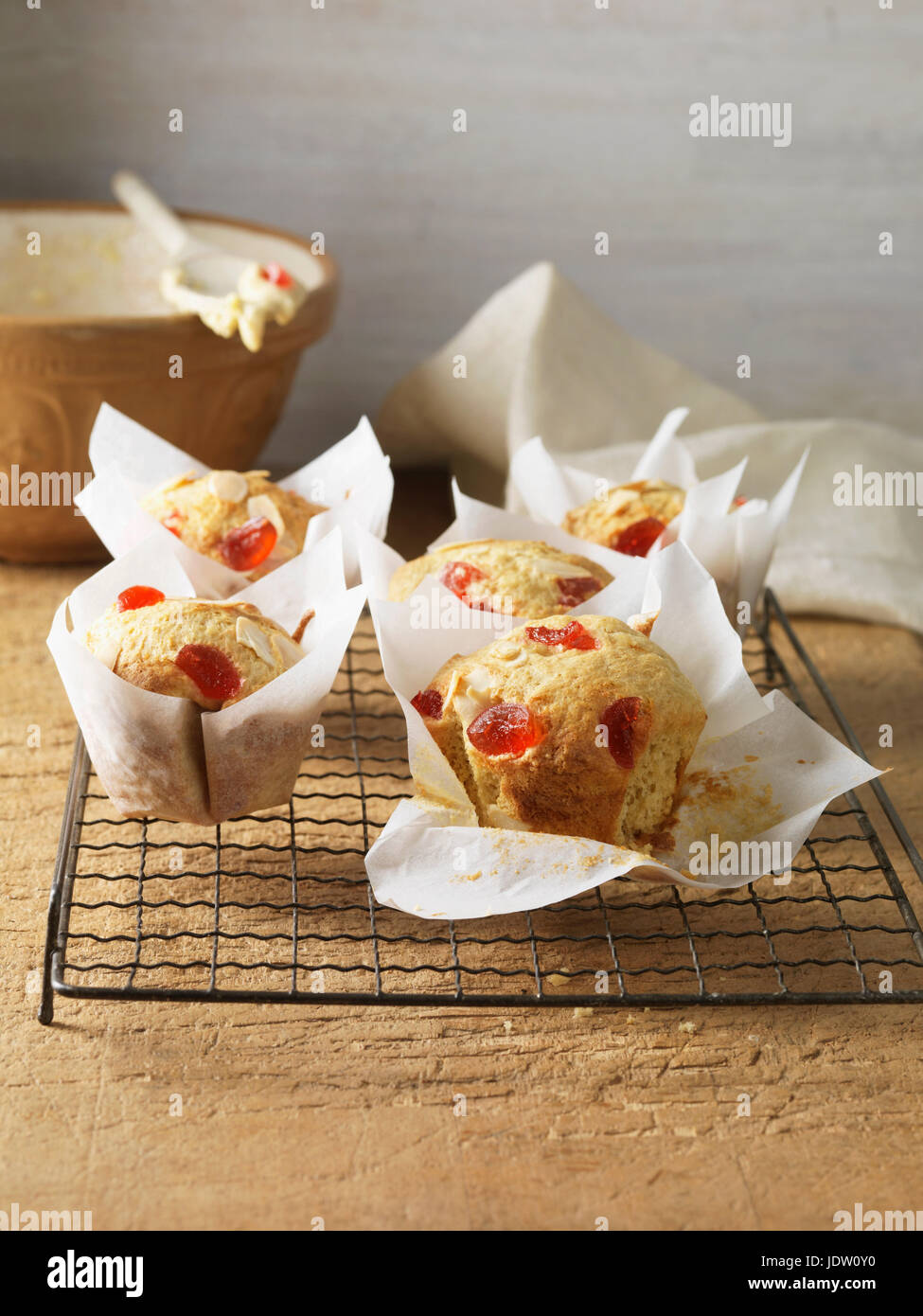 Cherry almond muffins on cooling rack Stock Photo