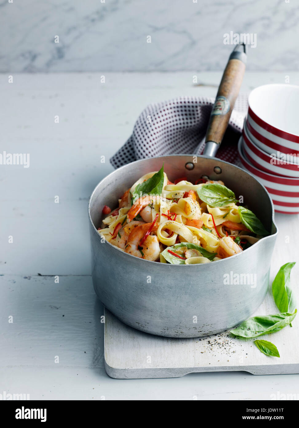 Pot of vegetable pasta on board Stock Photo