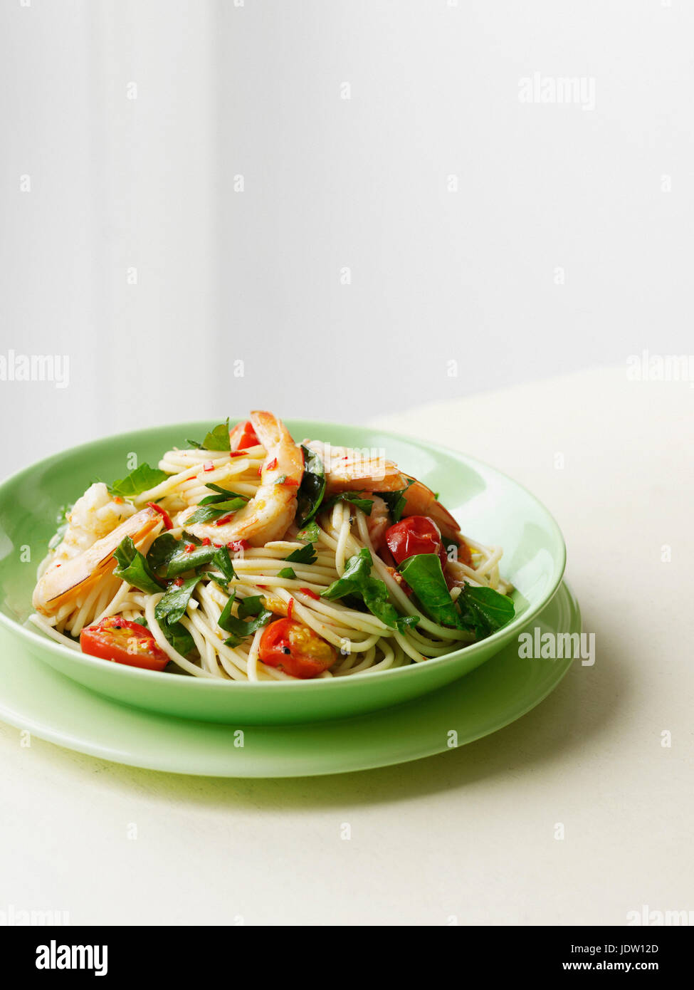 Plate of prawns and pasta Stock Photo