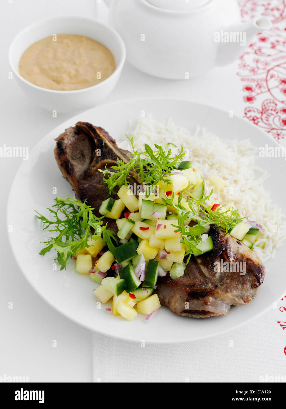 Plate of meat with chopped vegetables Stock Photo