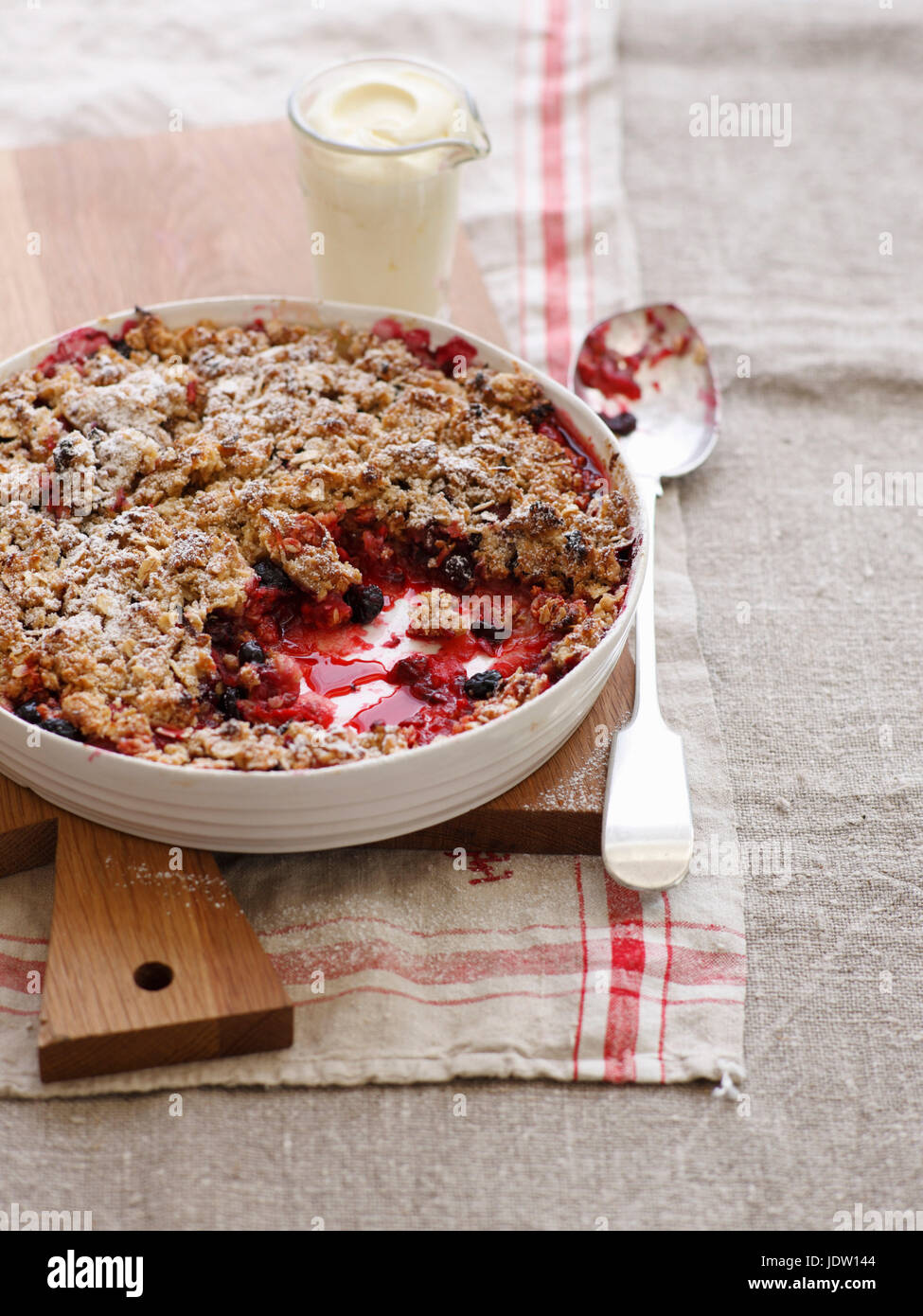 Bowl of baked fruit crisp Stock Photo Alamy