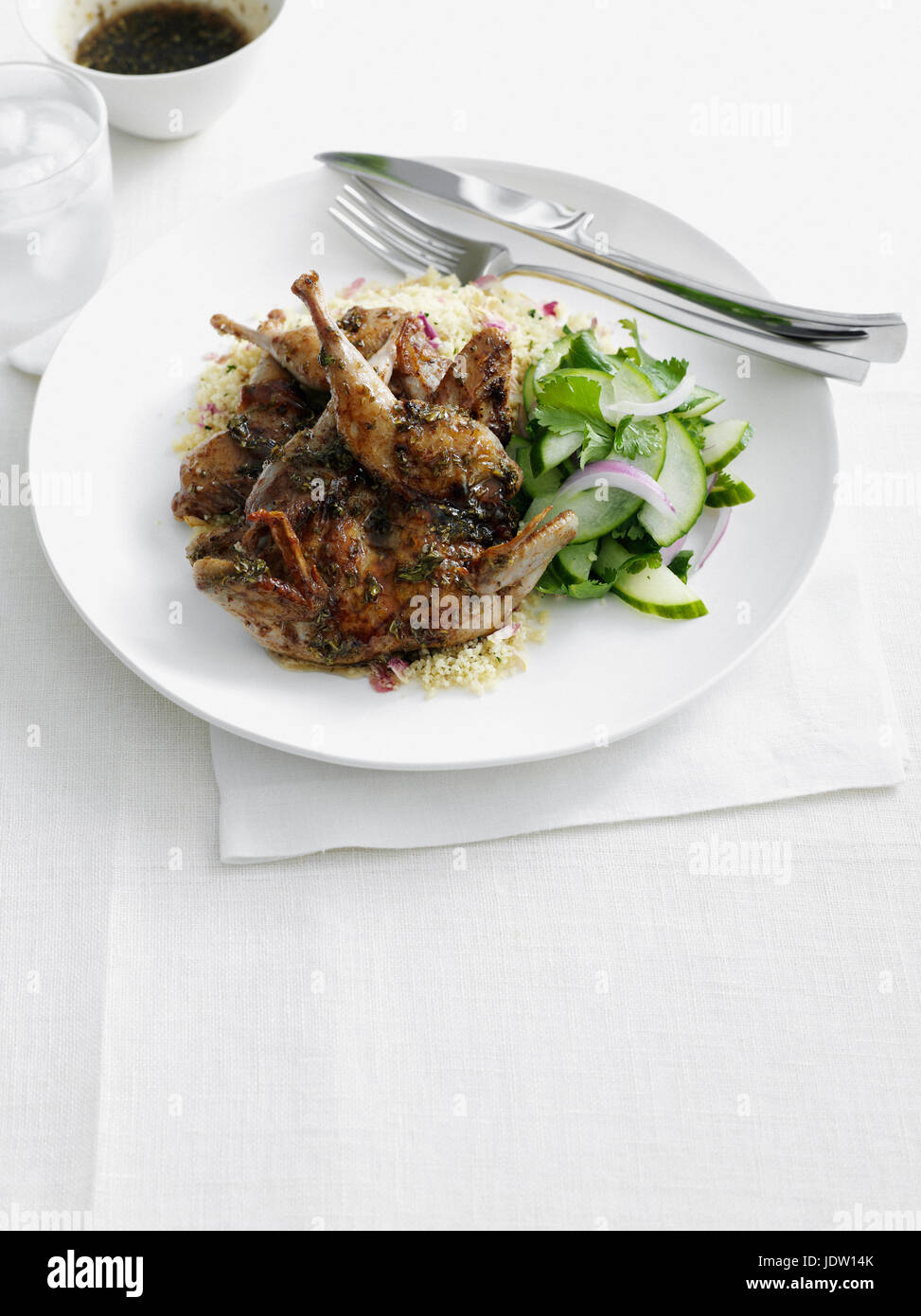 Plate of chicken with rice and salad Stock Photo