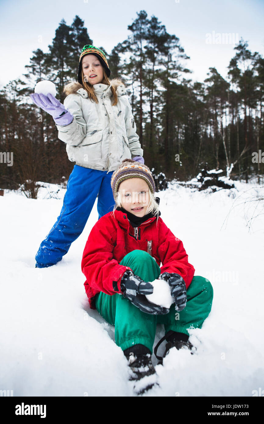 Child Making Snowballs Children making snowballs in snow Stock Photo - Alamy