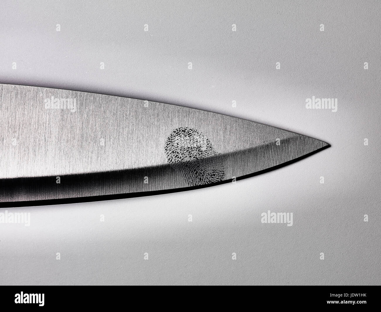 Close up of fingerprint on knife blade Stock Photo