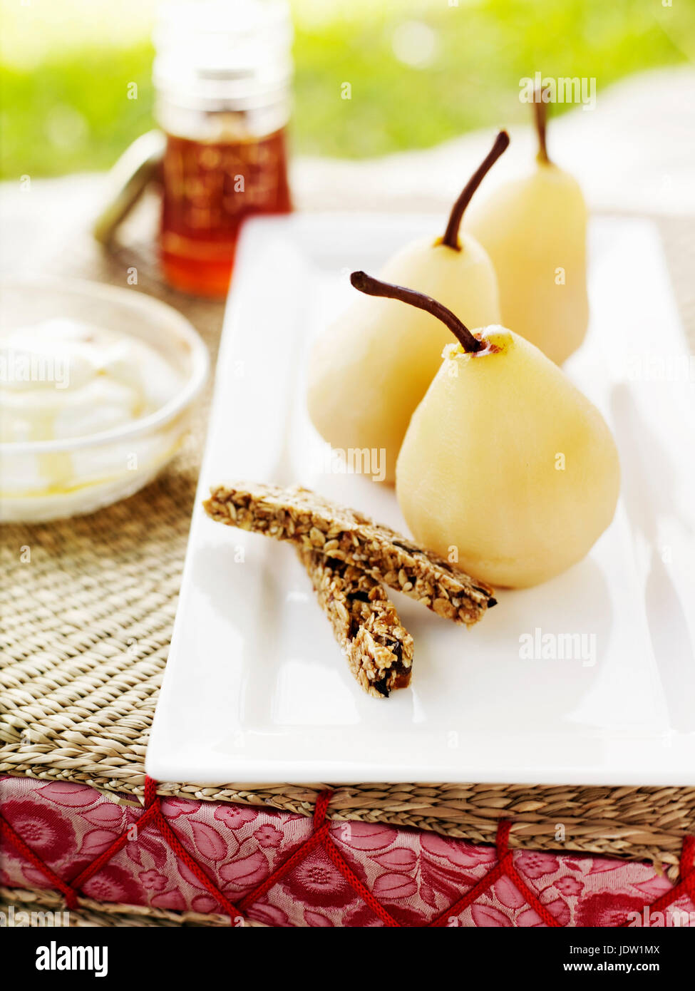 Dish of cooked pears and biscuits Stock Photo