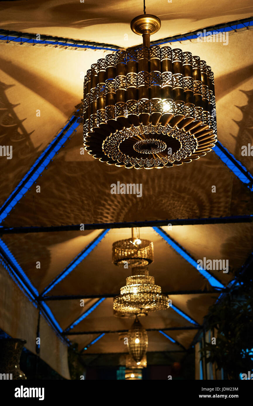 Ornate chandeliers hanging from ceiling Stock Photo
