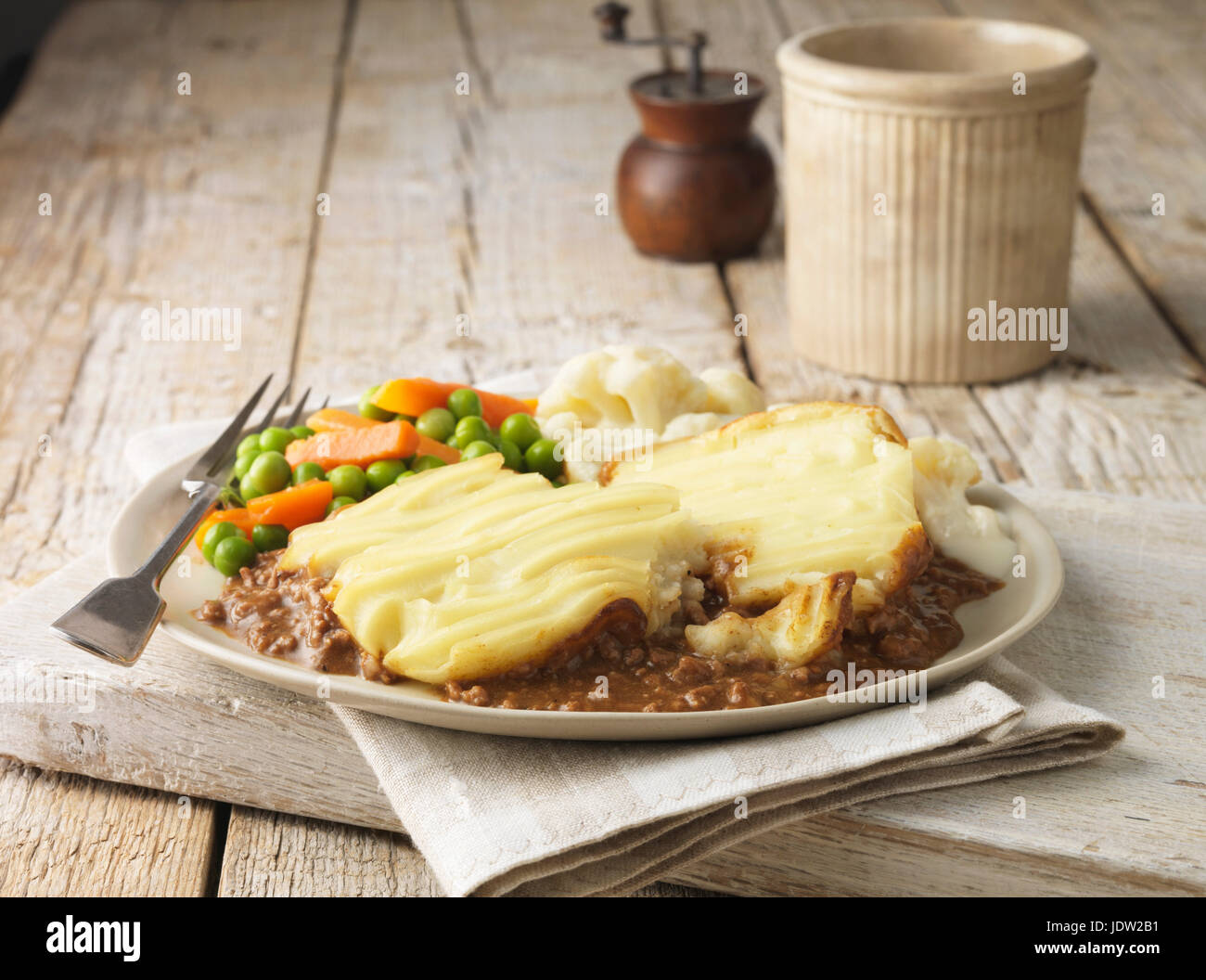 Plate of cottage pie with vegetables Stock Photo