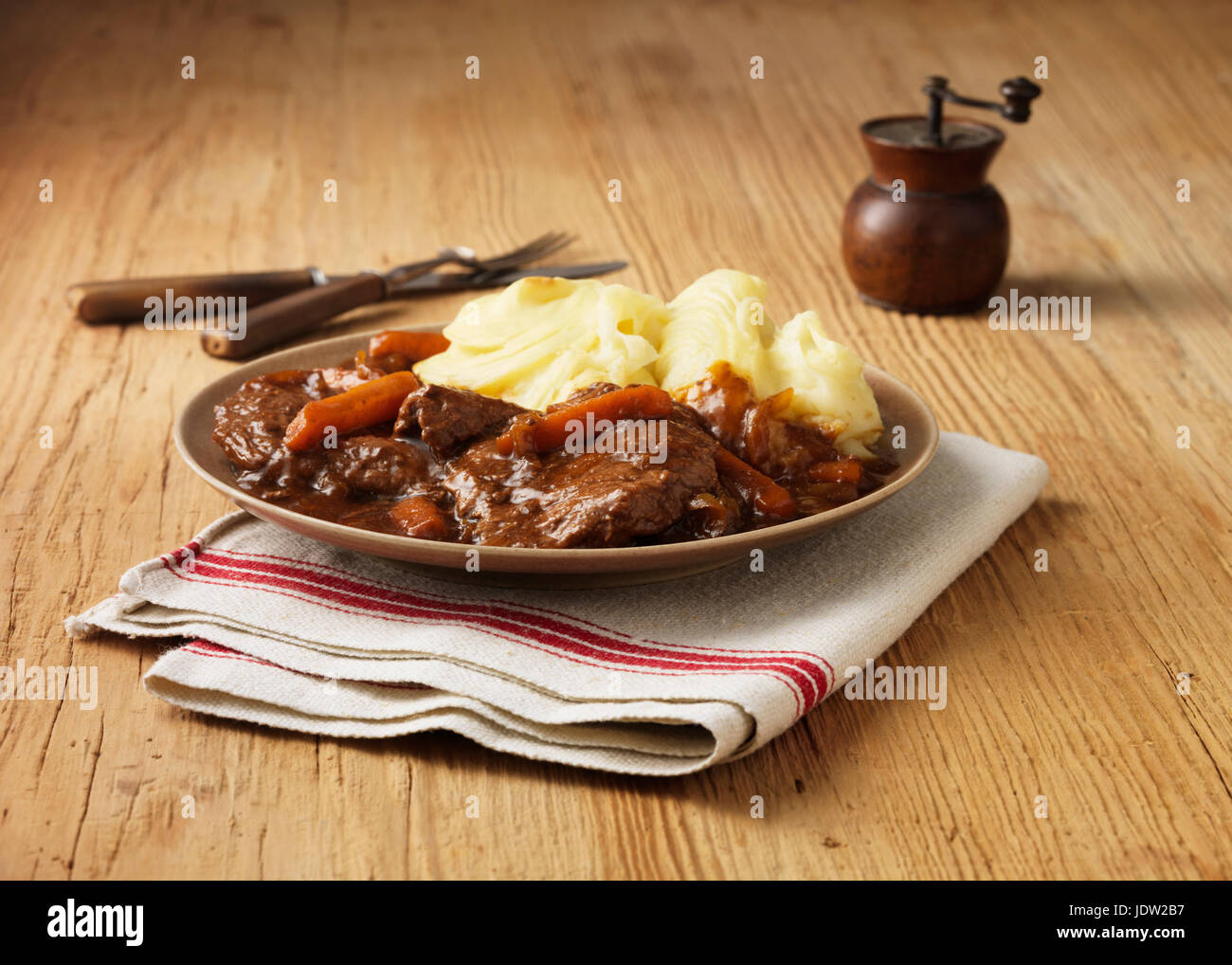 Plate of braised beef with potatoes Stock Photo