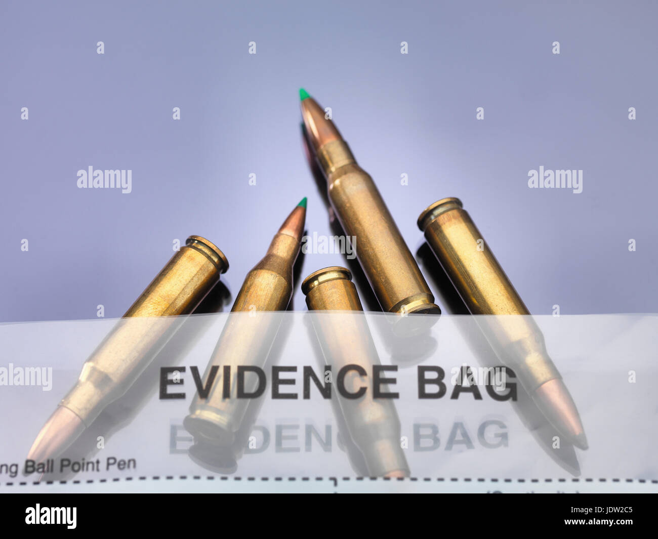 Bullets coming out of scene of crime forensic bag in a lab Stock Photo