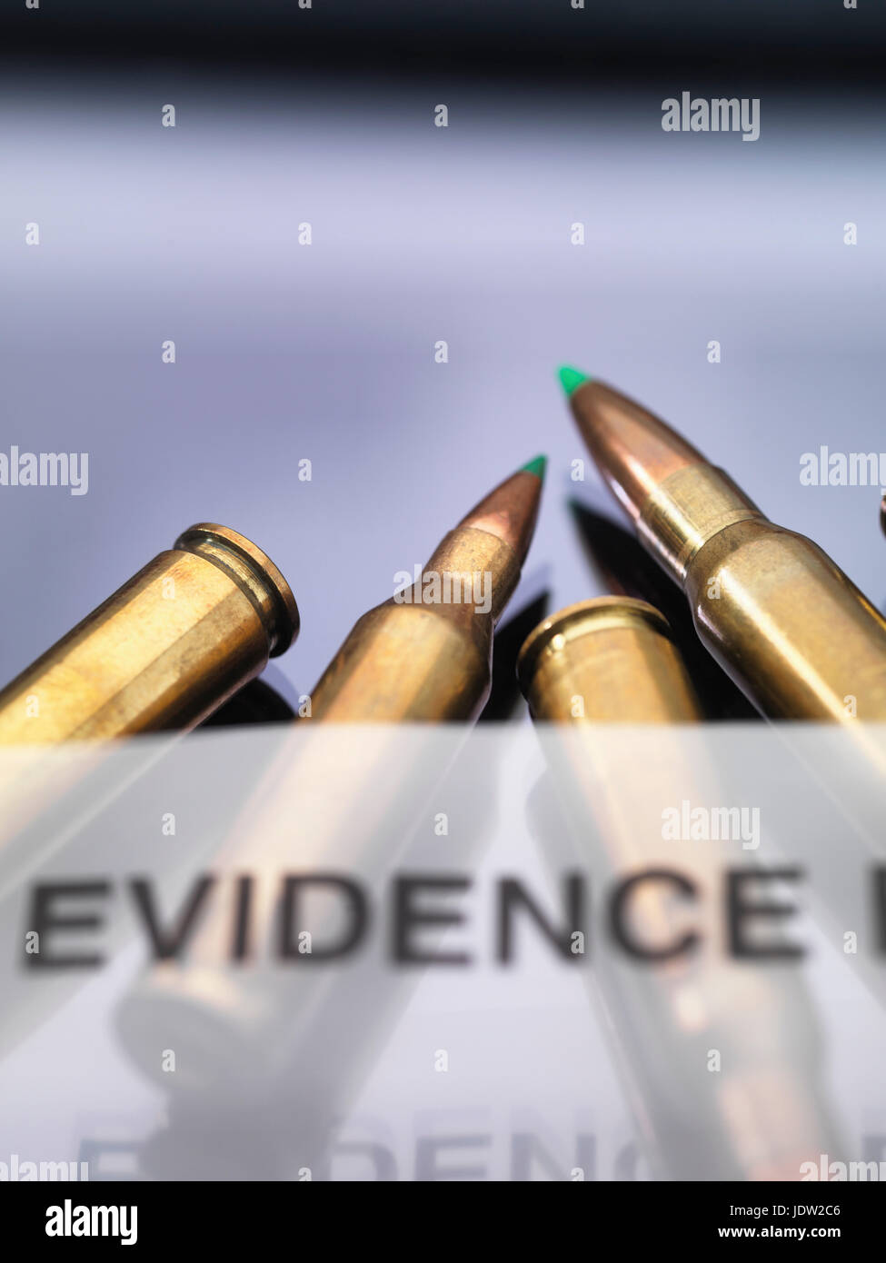 Bullets coming out of scene of crime forensic bag in a lab. Stock Photo