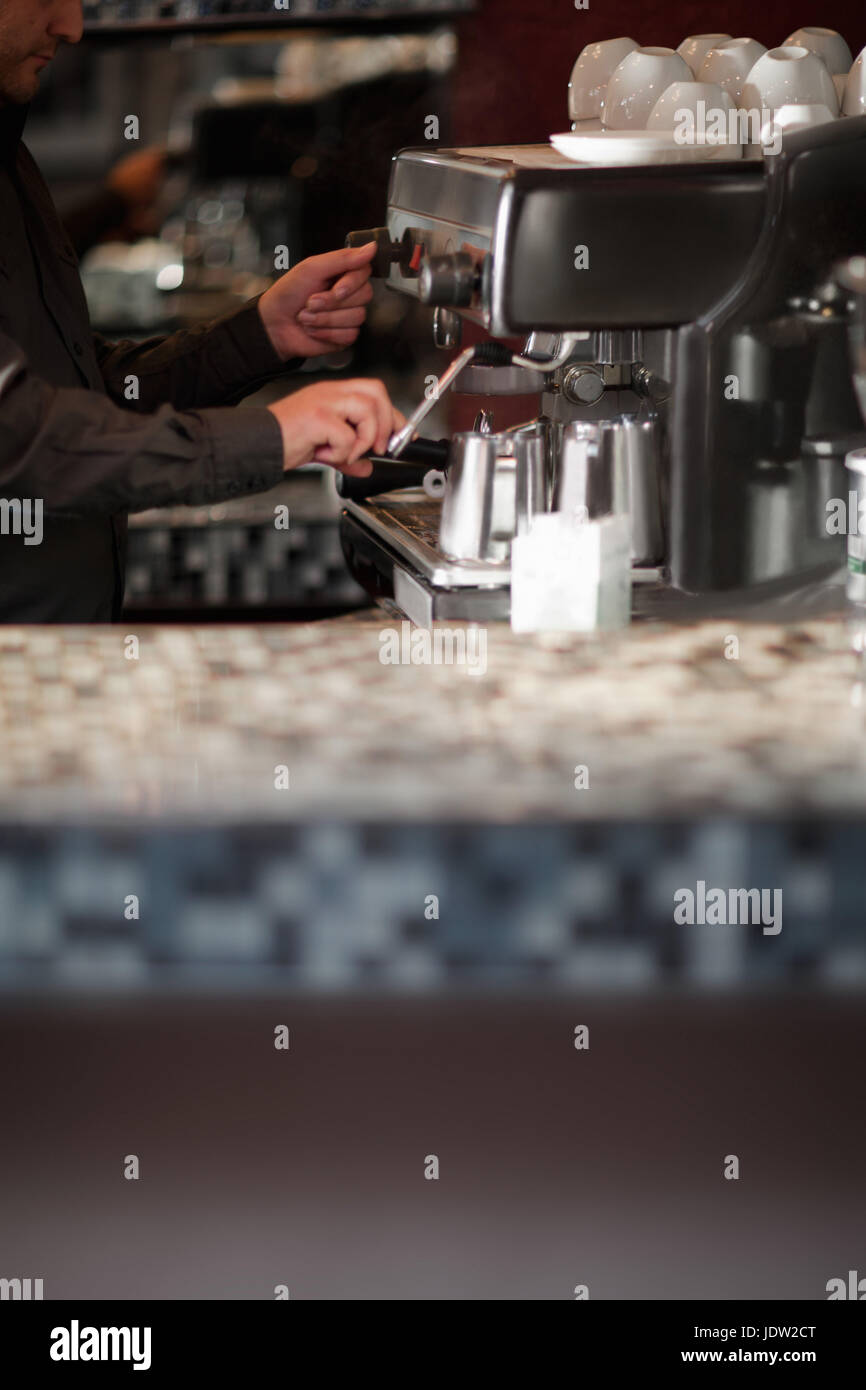 Barista using espresso machine at cafe Stock Photo Alamy
