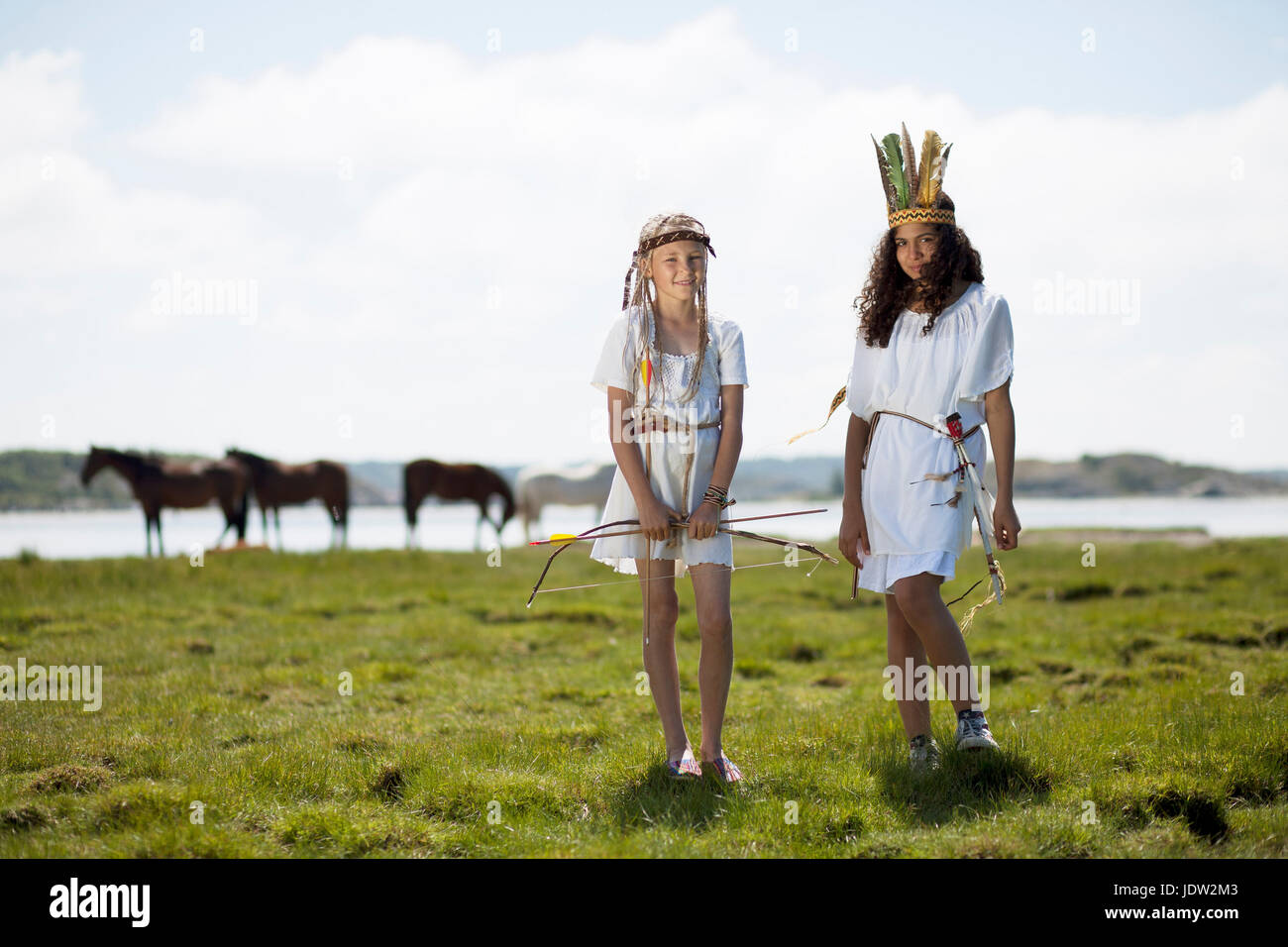 Girls wearing Native American costumes Stock Photo
