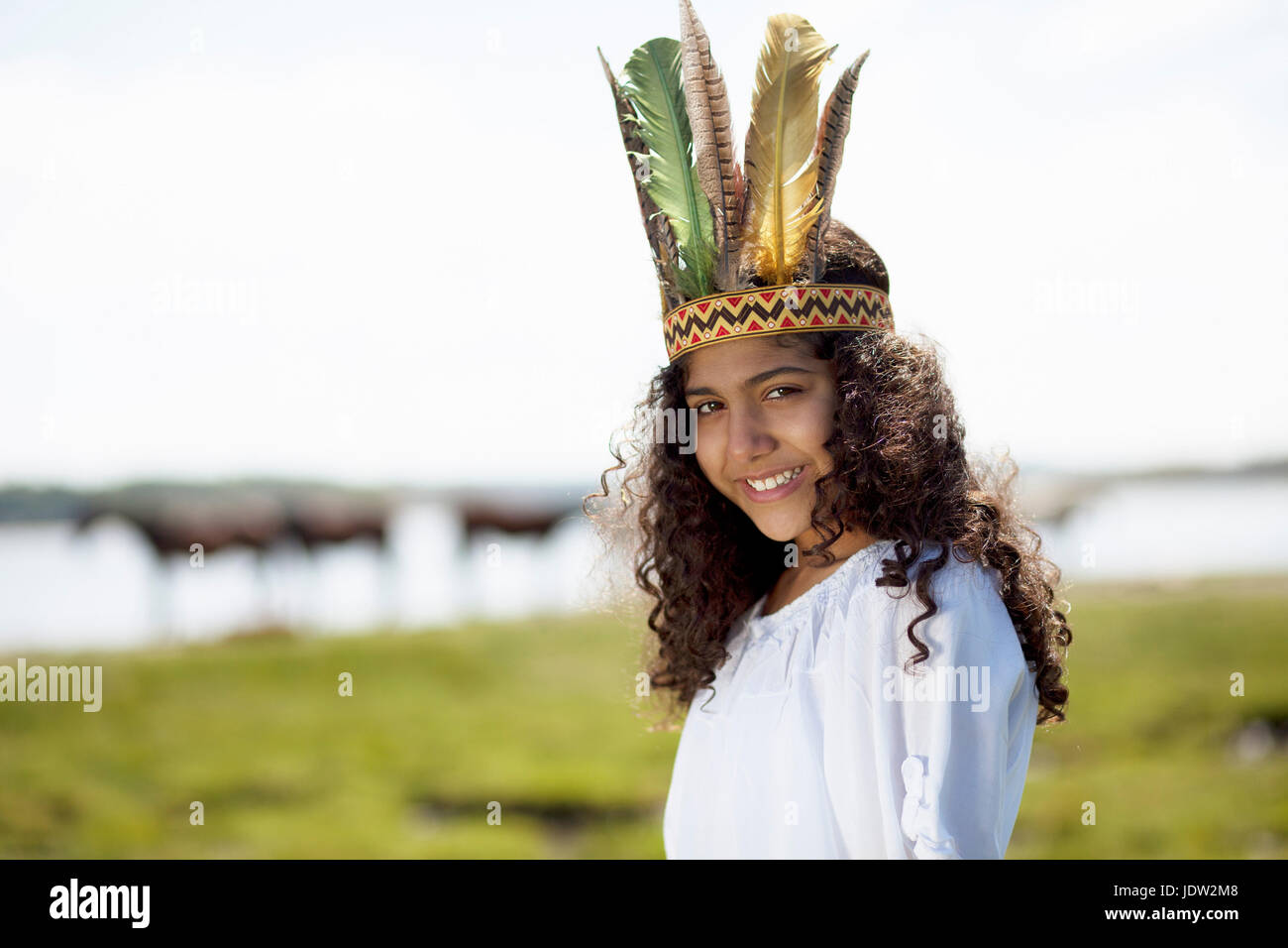 Girl wearing Native American costume Stock Photo