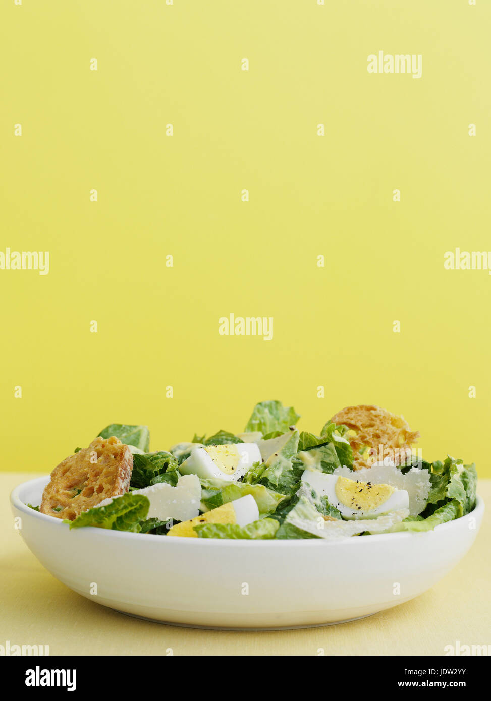 Bowl of caesar salad with egg Stock Photo Alamy