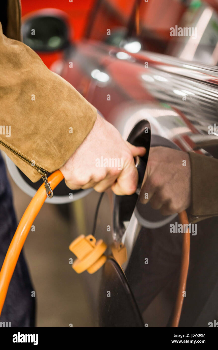 Man filling gas tank of car Stock Photo