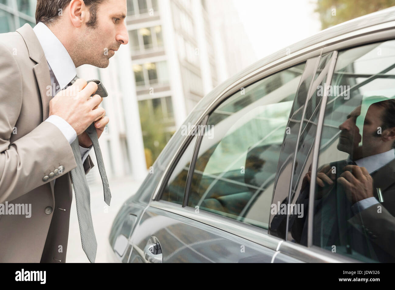 Adjusting Tie Hi res Stock Photography And Images Alamy adjusting-tie-hi-res-stock-photography-and-images-alamy