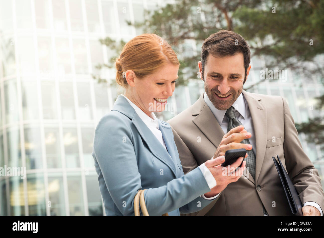 Business people using cell phone Stock Photo